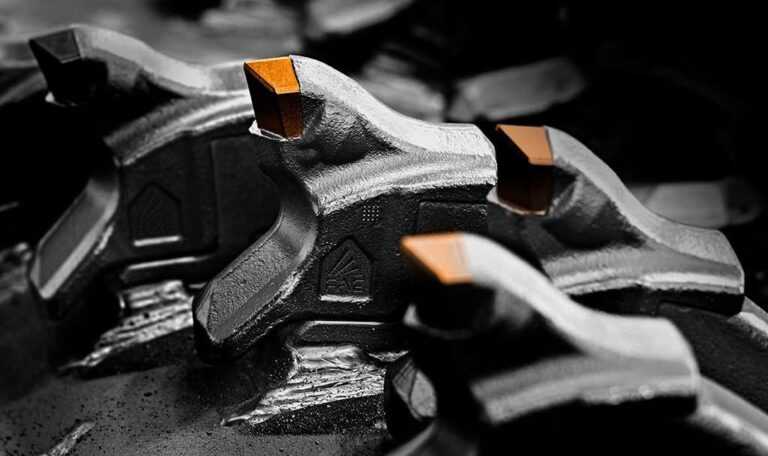 Close-up of tungsten carbide tip attached to a forestry mulcher tooth steel body