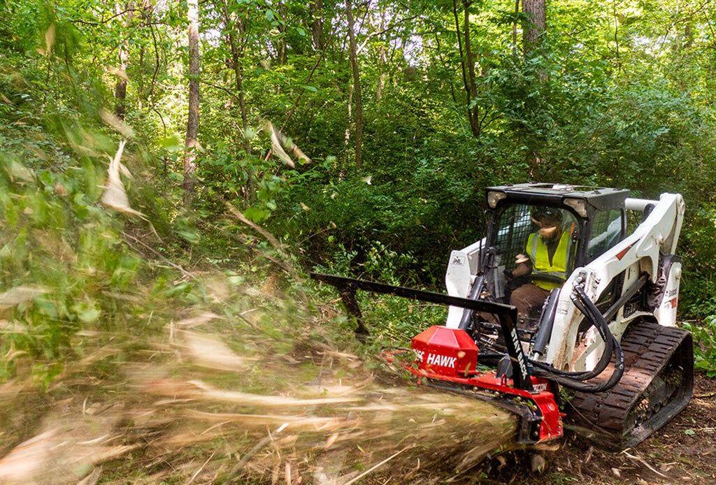 Disc mulcher clearing brush and small trees