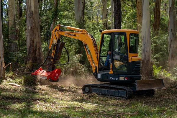 Flail mulcher cutting roadside vegetation